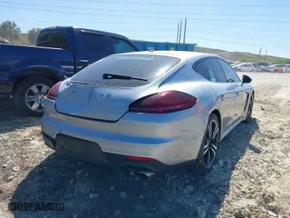 2014 Porsche Panamera S E-Hybrid with VIN WP0AD2A75EL044663, listed as a IAAI auction lot 41818381 with 44,194 mi miles. Bid and sale history available at carsss.com. Image 4.