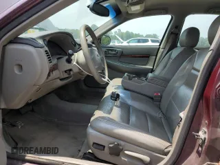 2004 Chevrolet Impala with VIN 2G1WF52E749123135, listed as a Copart auction lot 65401265 with 202,136 mi miles and Salvage title. Bid and sale history available at DreamBid. Image 7.