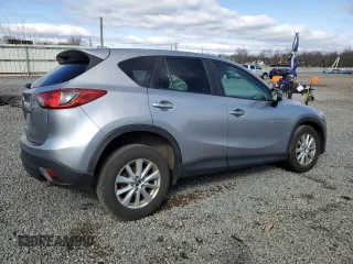 2014 Mazda CX-5 Touring with VIN JM3KE4CY4E0427294, listed as a Copart auction lot 51372155 with 121,324 mi miles and Salvage Title. Bid and sale history available at carsss.com. Image 3.