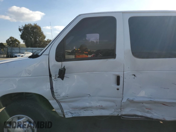 2011 Ford Econoline Passenger XL with VIN 1FBNE3BL0BDB17271, listed as a Copart auction lot 43022735 with 184,054 mi miles and Salvage Title. Bid and sale history available at carsss.com. Image 7.