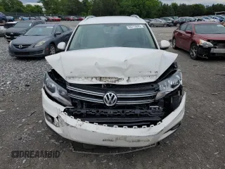 2014 Volkswagen Tiguan SE z VIN WVGAV3AX5EW551477, wystawiony jako Copart lot #55773245 z przebiegiem 153 437 mil mil oraz Czysty tytuł • Clean title. Historia ofert i sprzedaży dostępna na DreamBid. Obrazek 5.