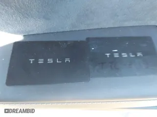 2023 Tesla Model 3 with VIN 5YJ3E1EA3PF678825, listed as a IAAI auction lot 41283153 with 8,607 mi miles. Bid and sale history available at carsss.com. Image 11.
