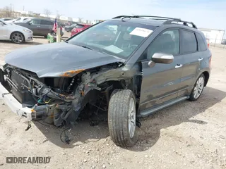 2012 Acura RDX with VIN 5J8TB1H21CA001175, listed as a IAAI auction lot 42038674 with 218,947 mi miles. Bid and sale history available at carsss.com. Image 2.
