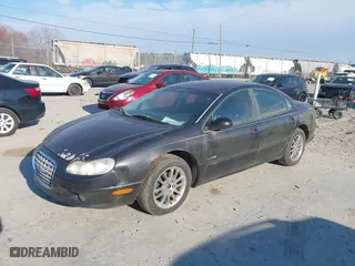 1999 Chrysler LHS with VIN 2C3HC56G5XH837185, listed as a IAAI auction lot 41865542 with 139,590 mi miles. Bid and sale history available at carsss.com. Image 2.
