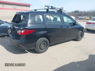 2014 Mazda 5 Sport with VIN JM1CW2BL5E0167153, listed as a IAAI auction lot 41790276 with 243,565 mi miles. Bid and sale history available at carsss.com. Image 4.