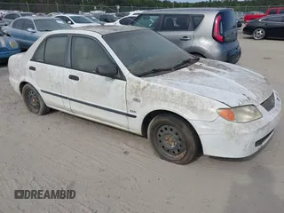 2003 Mazda Protege DX with VIN JM1BJ225730146488, listed as a IAAI auction lot 42086747 with Not Provided miles and . Bid and sale history available at DreamBid. Image 1.