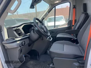 2023 Ford Transit Cargo with VIN 1FTBR1X87PKC09251, listed as a IAAI auction lot 42762766 with 20,509 mi miles and . Bid and sale history available at DreamBid. Image 2.