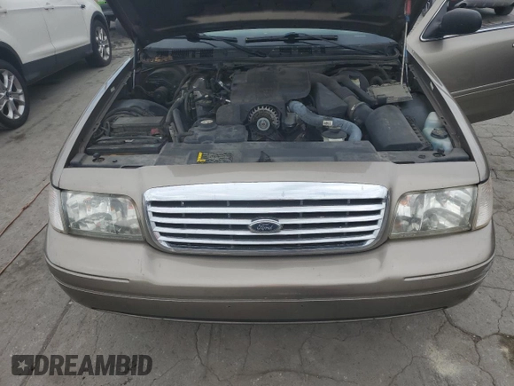 2005 Ford Crown Victoria LX z VIN 2FAFP74W95X147431, wystawiony jako Copart lot #73487374 z przebiegiem 203 107 mil mil oraz Nie do naprawy • Non repairable. Historia ofert i sprzedaży dostępna na DreamBid. Obrazek 11.