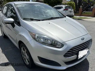 2015 Ford Fiesta SE z VIN 3FADP4EJ8FM167515, wystawiony jako IAAI lot #42153873 z przebiegiem 100 559 mil mil oraz . Historia ofert i sprzedaży dostępna na DreamBid. Obrazek 1.