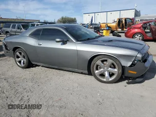 2012 Dodge Challenger R/T z VIN 2C3CDYBT2CH268592, wystawiony jako Copart lot #53143395 z przebiegiem 101 390 mil mil oraz Szkoda całkowita • Salvage title. Historia ofert i sprzedaży dostępna na DreamBid. Obrazek 4.