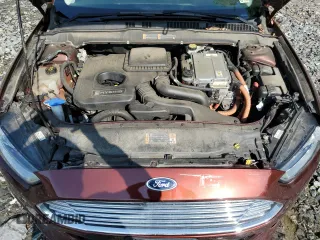 2016 Ford Fusion SE Hybrid z VIN 3FA6P0LU5GR377735, wystawiony jako Copart lot #58791955 z przebiegiem 135 798 mil mil oraz Szkoda całkowita • Salvage title. Historia ofert i sprzedaży dostępna na DreamBid. Obrazek 11.