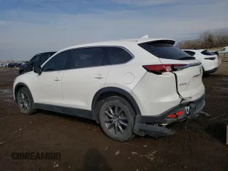 2020 Mazda CX-9 Touring with VIN JM3TCACY2L0407342, listed as a Copart auction lot 47590235 with 59,667 mi miles and Salvage title. Bid and sale history available at DreamBid. Image 2.