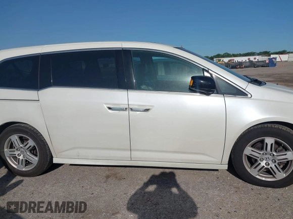 2012 Honda Odyssey Touring with VIN 5FNRL5H93CB125241, listed as a IAAI auction lot 42299053 with 125,549 mi miles and . Bid and sale history available at DreamBid. Image 13.
