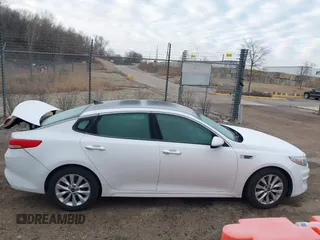 2016 Kia Optima EX with VIN 5XXGU4L31GG027250, listed as a IAAI auction lot 41881343 with 135,635 mi miles. Bid and sale history available at carsss.com. Image 13.