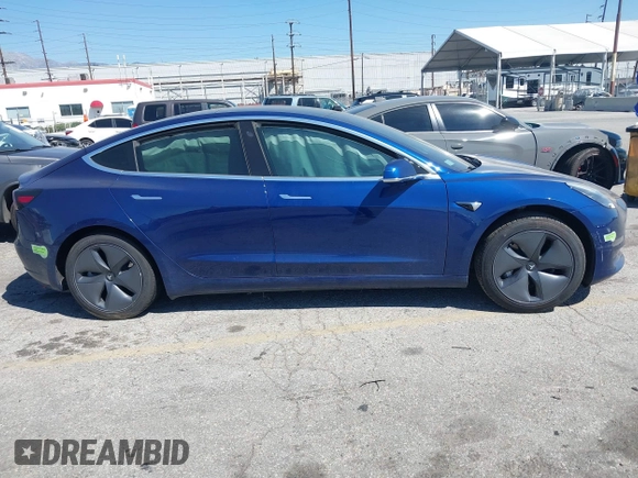 2020 Tesla Model 3 Standard Range Plus with VIN 5YJ3E1EA1LF590396, listed as a IAAI auction lot 41868089 with 51,278 mi miles. Bid and sale history available at carsss.com. Image 13.