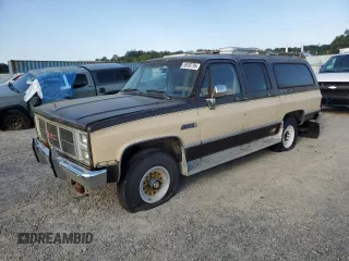 1987 GMC Suburban z VIN 1GKGV26K8HF511456, wystawiony jako Copart lot #59530795 z przebiegiem 71 410 mil mil oraz Czysty tytuł • Clean title. Historia ofert i sprzedaży dostępna na DreamBid. Obrazek 1.