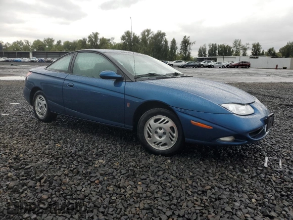 2001 Saturn SC z VIN 1G8ZR12791Z118164, wystawiony jako Copart lot #74393904 z przebiegiem 158 308 mil mil oraz Szkoda całkowita • Salvage title. Historia ofert i sprzedaży dostępna na DreamBid. Obrazek 4.