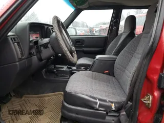1999 Jeep Cherokee SE with VIN 1J4FF28S9XL645291, listed as a Copart auction lot 87064124 with Not provided miles and Salvage title. Bid and sale history available at DreamBid. Image 7.