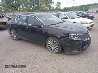 2013 Lincoln MKS z VIN 1LNHL9EK0DG600129, wystawiony jako IAAI lot #42314913 z przebiegiem 119 674 mil mil oraz . Historia ofert i sprzedaży dostępna na DreamBid. Obrazek 1.