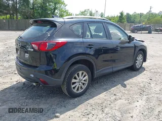 2014 Mazda CX-5 Sport with VIN JM3KE2BE3E0405976, listed as a IAAI auction lot 42161069 with 66,301 mi miles and . Bid and sale history available at carsss.com. Image 4.