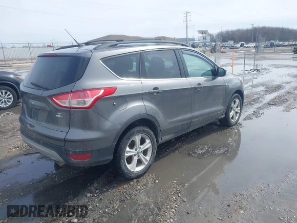 2014 Ford Escape SE with VIN 1FMCU9GX0EUA37649, listed as a IAAI auction lot 41834356 with 189,953 mi miles. Bid and sale history available at carsss.com. Image 4.
