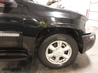 2004 GMC Envoy SLE with VIN 1GKDT13S542265104, listed as a IAAI auction lot 41884797 with 154,190 mi miles. Bid and sale history available at carsss.com. Image 6.