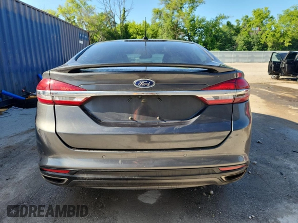 2017 Ford Fusion Titanium z VIN 3FA6P0D96HR251752, wystawiony jako Copart lot #61568705 z przebiegiem 173 479 mil mil oraz Nie do naprawy • Non repairable. Historia ofert i sprzedaży dostępna na DreamBid. Obrazek 6.