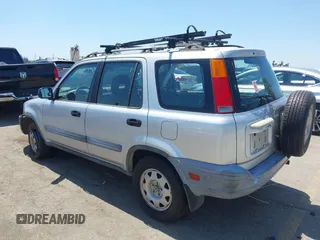 1999 Honda CR-V LX with VIN JHLRD2847XC000944, listed as a IAAI auction lot 42082593 with 198,474 mi miles. Bid and sale history available at carsss.com. Image 3.