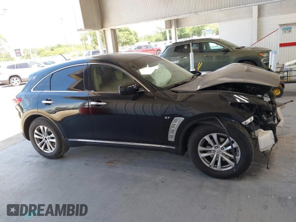 2017 Infiniti QX70 z VIN JN8CS1MU1HM143574, wystawiony jako IAAI lot #42546397 z przebiegiem 103 624 mil mil oraz . Historia ofert i sprzedaży dostępna na DreamBid. Obrazek 13.