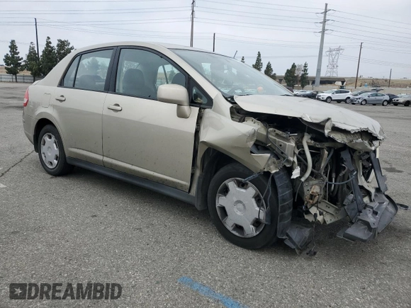 2009 Nissan Versa S with VIN 3N1BC11E79L433933, listed as a Copart auction lot 54953675 with 196,785 mi miles and Salvage Title. Bid and sale history available at DreamBid. Image 4.