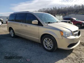 2014 Dodge Grand Caravan SXT with VIN 2C4RDGCG3ER347350, listed as a Copart auction lot 50575985 with 111,078 mi miles and Salvage Title. Bid and sale history available at DreamBid. Image 4.