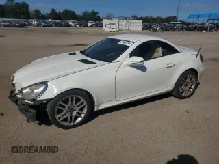 2009 Mercedes-Benz SLK-Class 3.0L with VIN WDBWK54F79F209339, listed as a Copart auction lot 77400294 with 68,540 mi miles and Salvage Title. Bid and sale history available at carsss.com. Image 1.