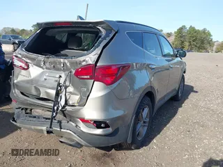 2018 Hyundai Santa Fe 2.4L z VIN 5NMZUDLB7JH077241, wystawiony jako IAAI lot #42135854 z przebiegiem 59 819 mil mil oraz . Historia ofert i sprzedaży dostępna na DreamBid. Obrazek 4.