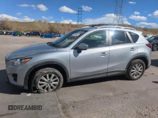 2016 Mazda CX-5 Touring z VIN JM3KE4CY0G0871601, wystawiony jako Copart lot #54096945 z przebiegiem 137 516 mil mil oraz Szkoda całkowita • Salvage title. Historia ofert i sprzedaży dostępna na DreamBid. Obrazek 1.