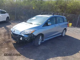 2012 Mazda 5 Grand Touring with VIN JM1CW2DL6C0138979, listed as a IAAI auction lot 41936188 with 57,963 mi miles and . Bid and sale history available at carsss.com. Image 2.