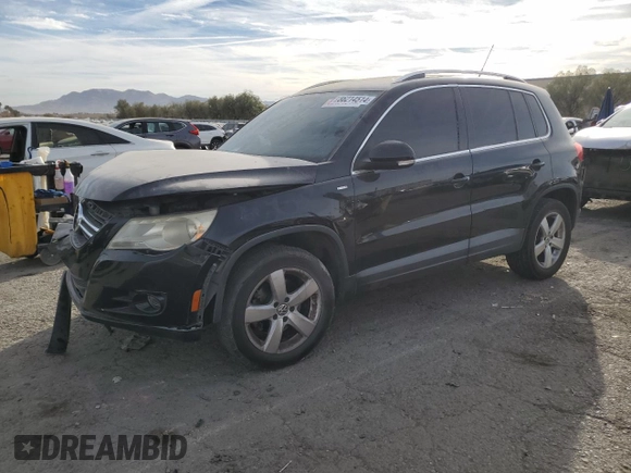 2010 Volkswagen Tiguan Wolfsburg Edition with VIN WVGAV7AX5AW002900, listed as a Copart auction lot 86214514 with 153,645 mi miles and Salvage title. Bid and sale history available at DreamBid. Image 1.