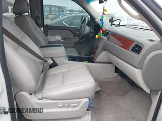 2014 Chevrolet Suburban LT with VIN 1GNSCJE06ER154639, listed as a IAAI auction lot 41410623 with 213,592 mi miles. Bid and sale history available at carsss.com. Image 5.