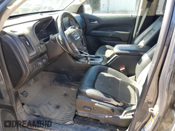 2016 GMC Canyon z VIN 1GTP6CE1XG1368688, wystawiony jako Copart lot #76475004 z przebiegiem 217 695 mil mil oraz Szkoda całkowita • Salvage title. Historia ofert i sprzedaży dostępna na DreamBid. Obrazek 7.