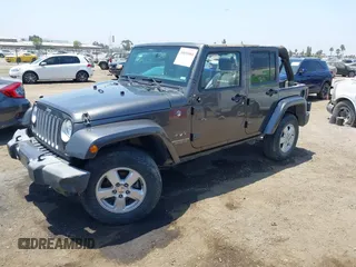 2016 Jeep Wrangler Unlimited Sahara with VIN 1C4HJWEG2GL273507, listed as a IAAI auction lot 39855004 with 87,011 mi miles and . Bid and sale history available at DreamBid. Image 2.