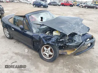 1996 Mazda MX-5 Miata z VIN JM1NA353XT0709160, wystawiony jako IAAI lot #41963107 z przebiegiem 166 807 mil mil oraz . Historia ofert i sprzedaży dostępna na DreamBid. Obrazek 1.