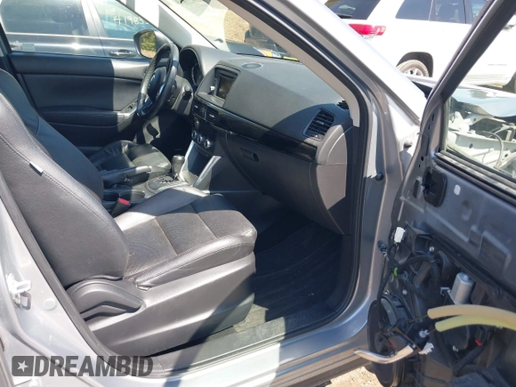 2013 Mazda CX-5 Grand Touring with VIN JM3KE4DE9D0137085, listed as a IAAI auction lot 41978534 with 103,720 mi miles and . Bid and sale history available at carsss.com. Image 5.