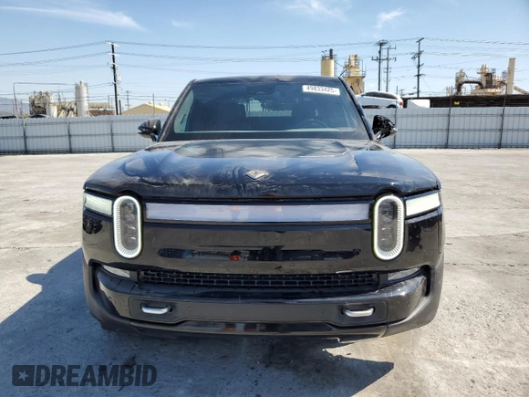 2023 Rivian R1T Adventure z VIN 7FCTGBAA6PN029702, wystawiony jako Copart lot #49833425 z przebiegiem 6608 mil mil oraz Szkody całkowita. Historia ofert i sprzedaży dostępna na DreamBid. Obrazek 5.
