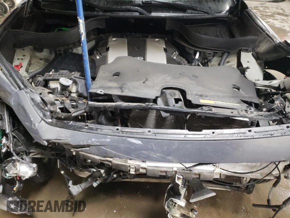 2014 Infiniti QX70 z VIN JN8CS1MW5EM412429, wystawiony jako Copart lot #82933934 z przebiegiem Nie podano mil oraz Szkoda całkowita • Salvage title. Historia ofert i sprzedaży dostępna na DreamBid. Obrazek 11.