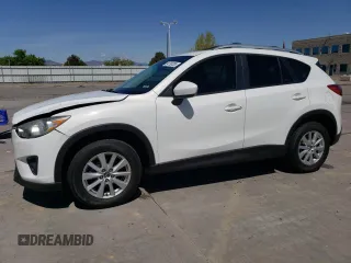 2014 Mazda CX-5 Touring z VIN JM3KE4CYXE0393443, wystawiony jako Copart lot #54738705 z przebiegiem 68 220 mil mil oraz Szkody całkowita. Historia ofert i sprzedaży dostępna na DreamBid. Obrazek 1.
