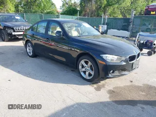 2014 BMW 3 Series 328i xDrive with VIN WBA3B5G56ENS06890, listed as a IAAI auction lot 42168982 with 133,664 mi miles. Bid and sale history available at carsss.com. Image 1.