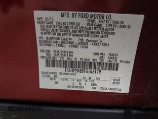 2015 Ford Taurus SEL z VIN 1FAHP2H88FG163179, wystawiony jako IAAI lot #42345579 z przebiegiem 142 424 mil mil oraz . Historia ofert i sprzedaży dostępna na DreamBid. Obrazek 9.
