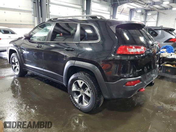 2014 Jeep Cherokee Trailhawk with VIN 1C4PJMBSXEW187981, listed as a Copart auction lot 56711885 with 157,317 mi miles and Salvage title. Bid and sale history available at DreamBid. Image 2.