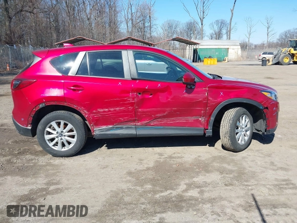 2014 Mazda CX-5 Touring with VIN JM3KE2CY2E0374440, listed as a IAAI auction lot 41634144 with 106,145 mi miles and . Bid and sale history available at DreamBid. Image 14.
