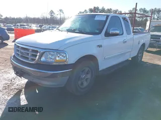 2000 Ford F-150 XL with VIN 1FTZX172XYNB36456, listed as a IAAI auction lot 41554603 with 239,766 mi miles. Bid and sale history available at carsss.com. Image 2.