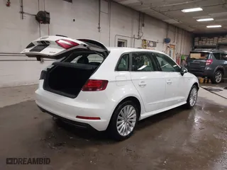 2016 Audi A3 e-tron Premium Plus with VIN WAUTPBFF2GA100666, listed as a IAAI auction lot 41315165 with 98,549 mi miles. Bid and sale history available at carsss.com. Image 4.